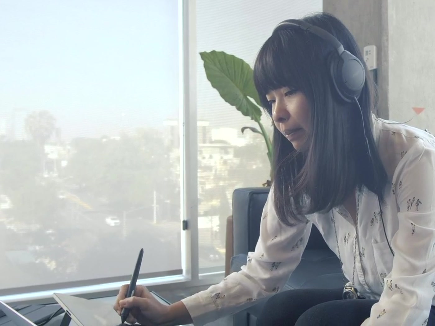 Designer working on a digital drawing tablet