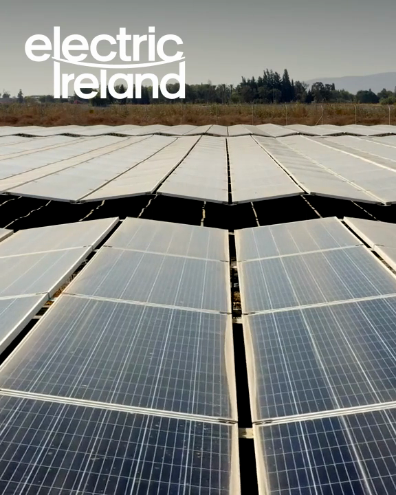 Electric Ireland wordmark over illustrative solar energy, panel installation and aerial footage.